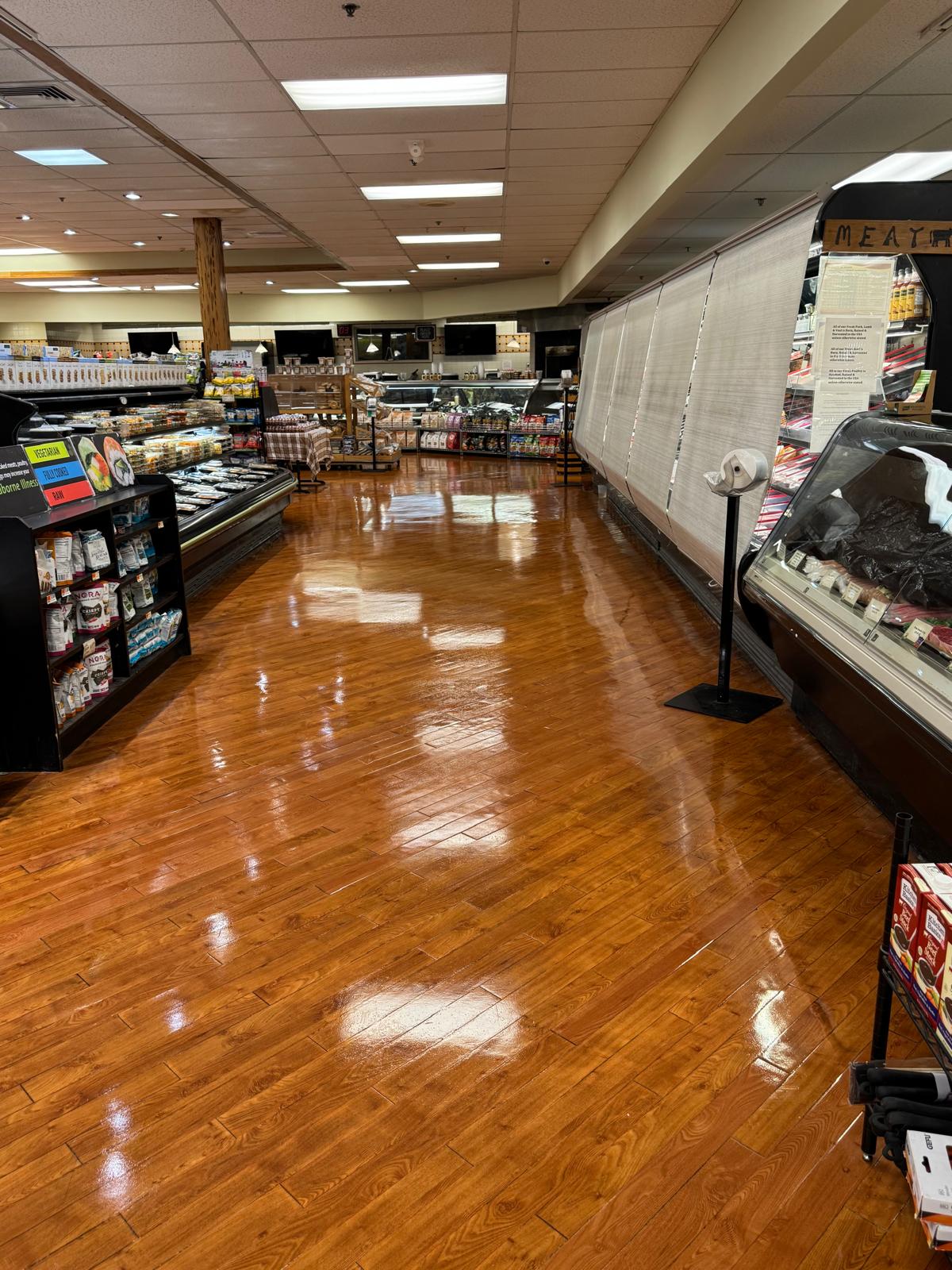 Meat department wood floor after stripping and waxing