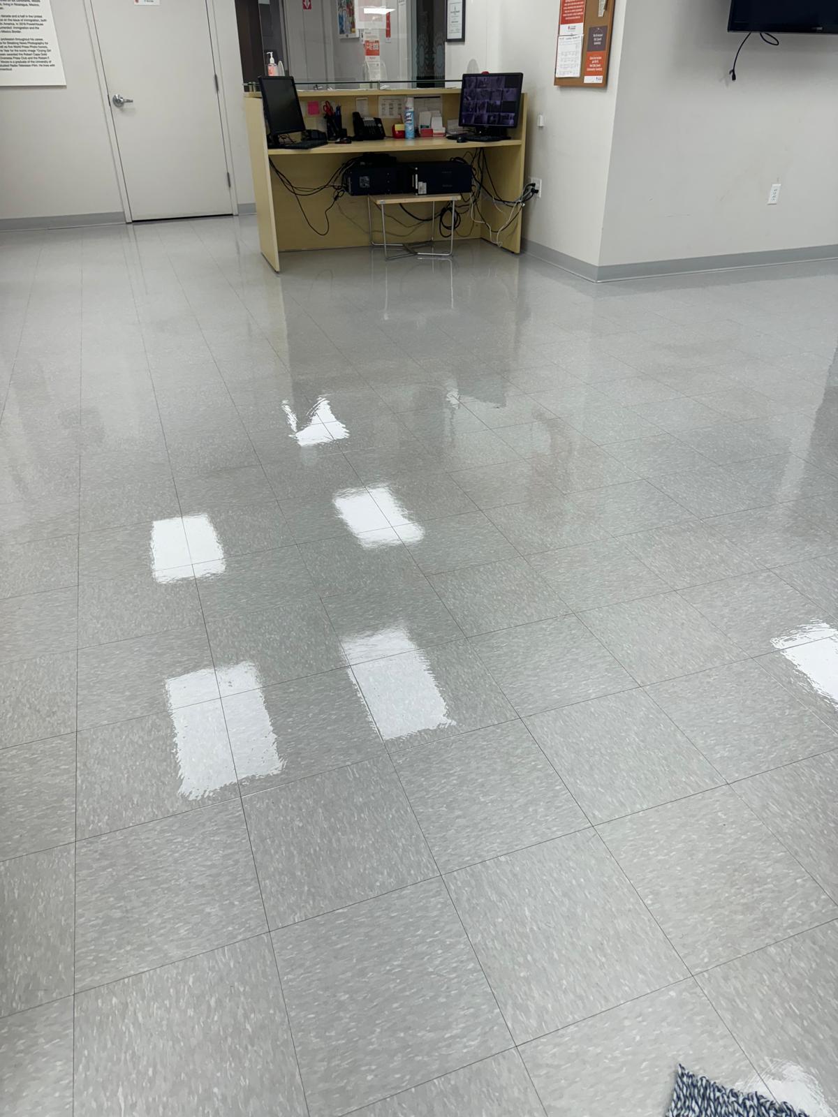 Office lobby gray VCT tile after stripping and waxing