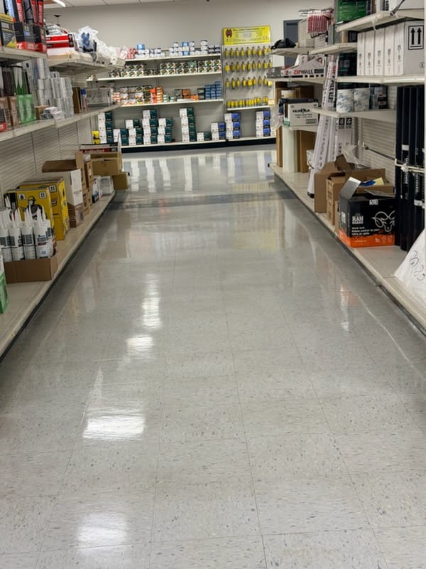 Retail commercial VCT tile floor after stripping and waxing