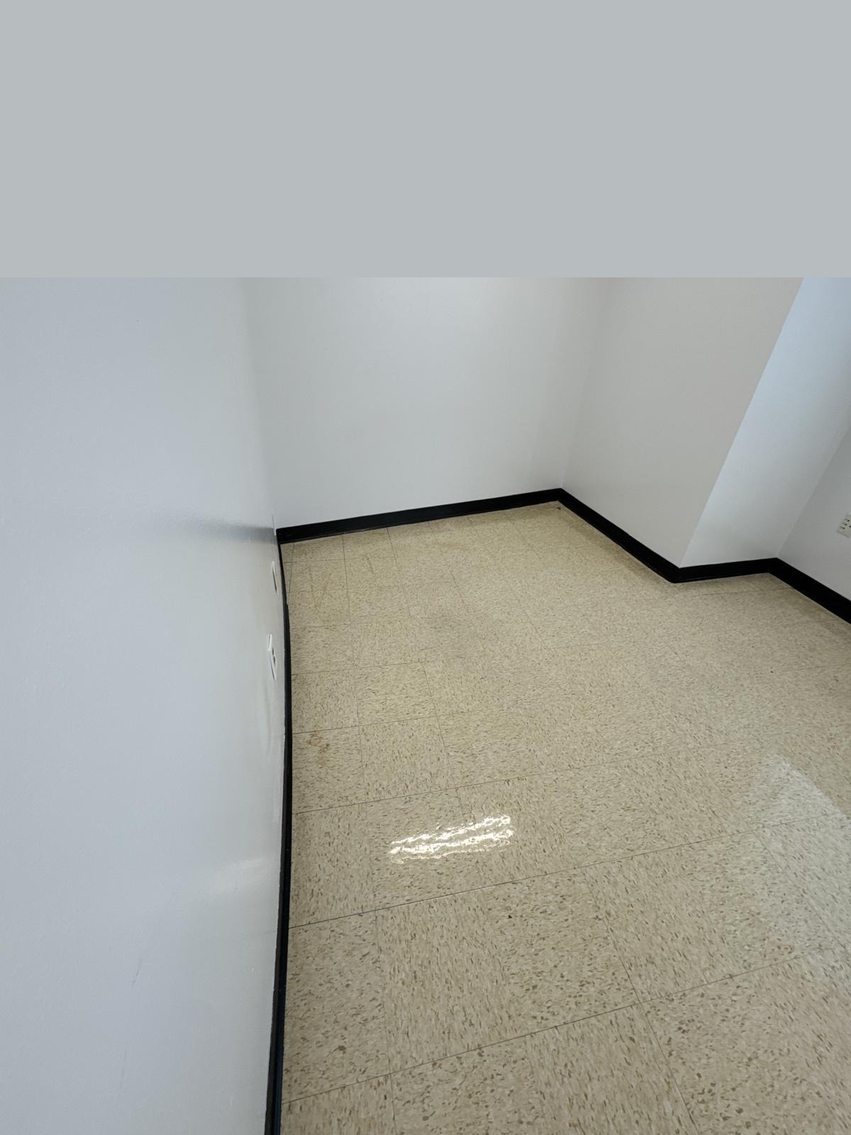 VCT tile floor after stripping and waxing - high gloss finish