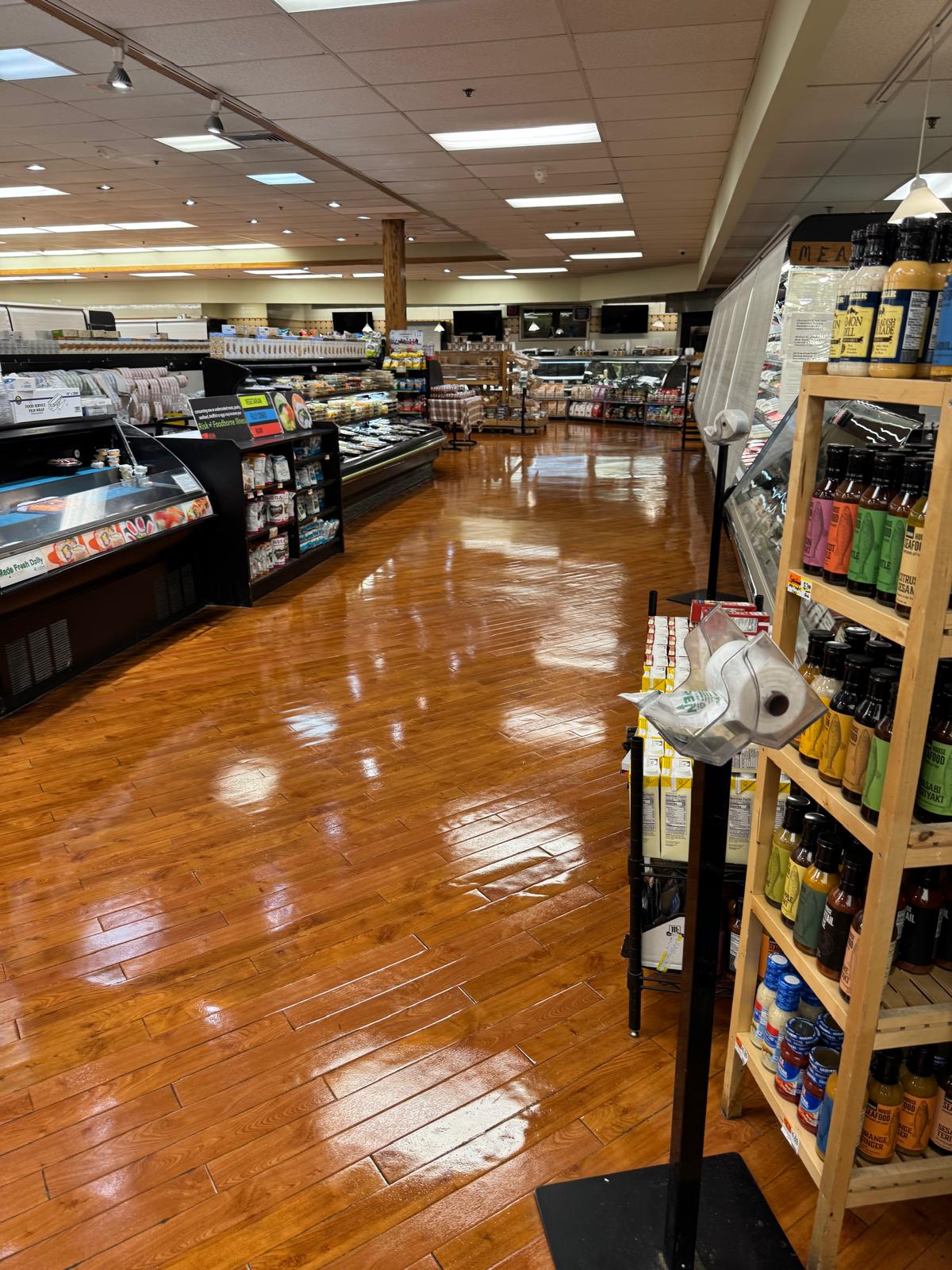 Wax being applied to commercial wood floor